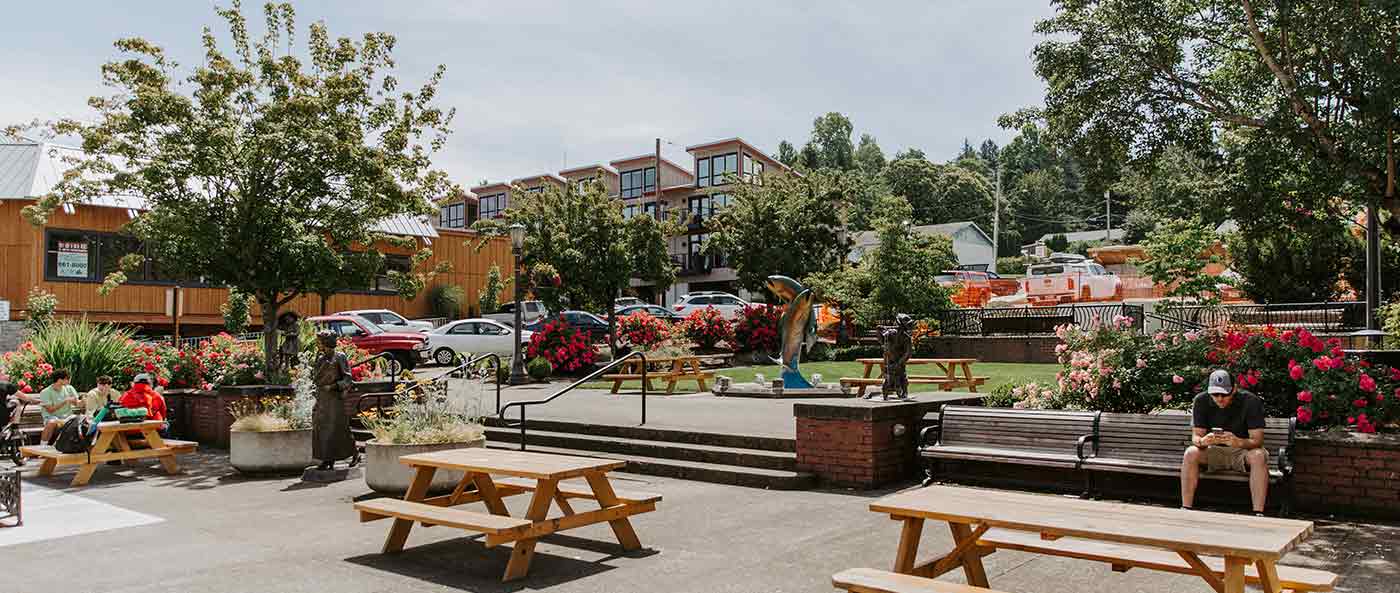 downtown seating area, picnic tables, condo in background