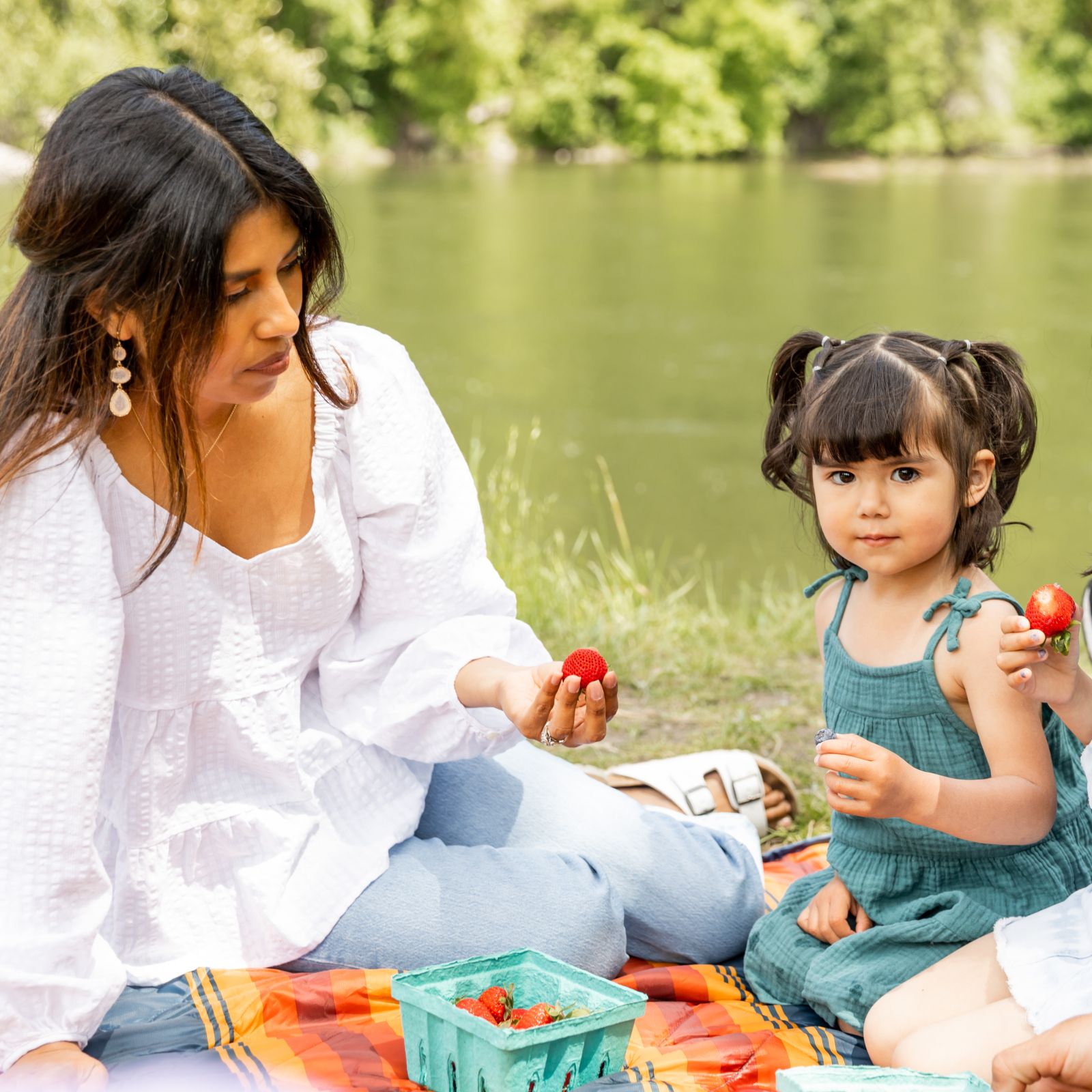 Family picnicking on the banks of the Sandy River at Glenn Otto Park